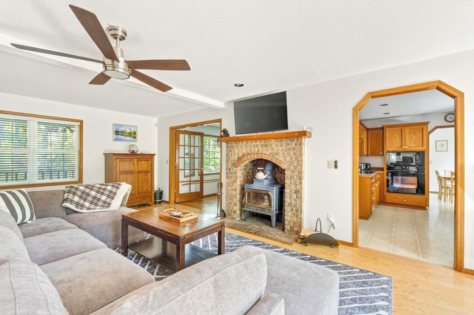 Living room open to kitchen and dining.