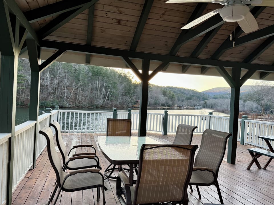 The boat house has plenty of seating for meals, sunbathing and a porch swing!
