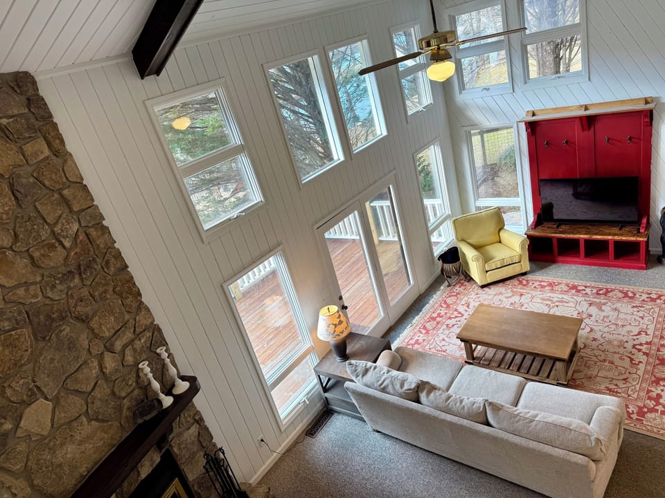 A view of the spacious living area from the upstairs landing.