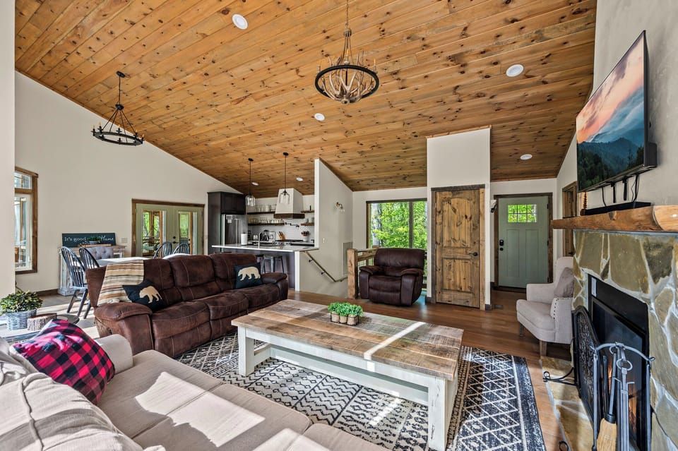 Open concept living room with view of dining area and kitchen.