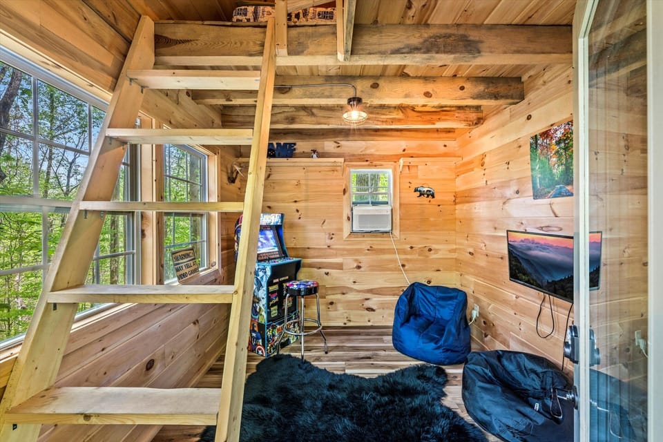 Kids’ paradise: arcade games, beanbags, and a loft hideaway.