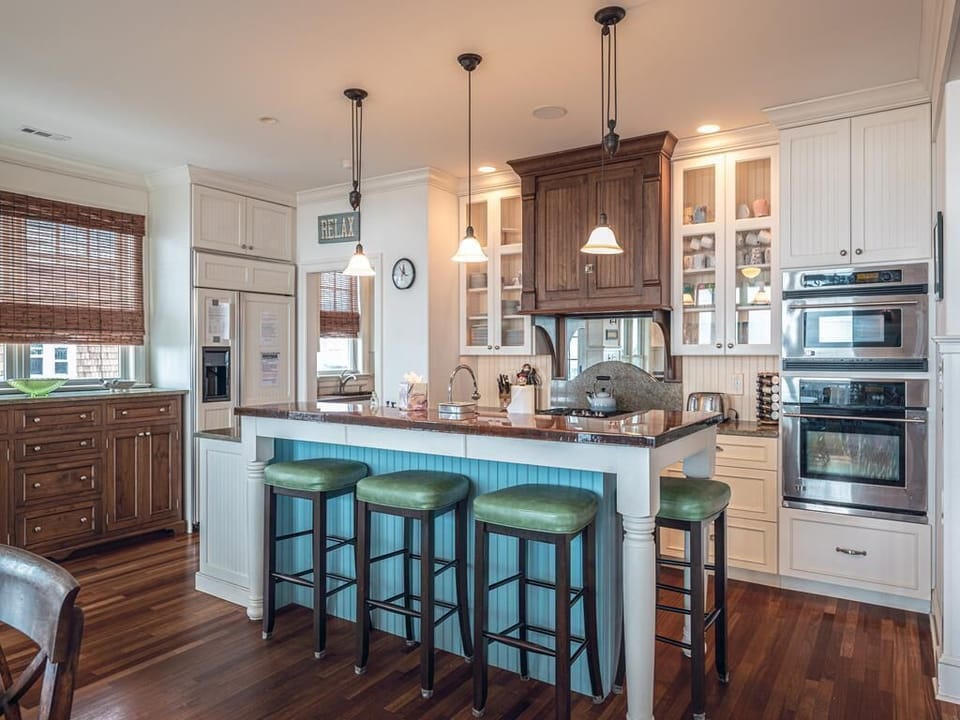 A chef’s dream! The fully equipped kitchen features stainless steel appliances, a large island with seating, and plenty of space for meal prep.
