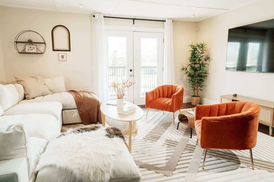 Warm tones, soft textures, and tons of sunlight make this a living room you’ll actually want to hang out in.