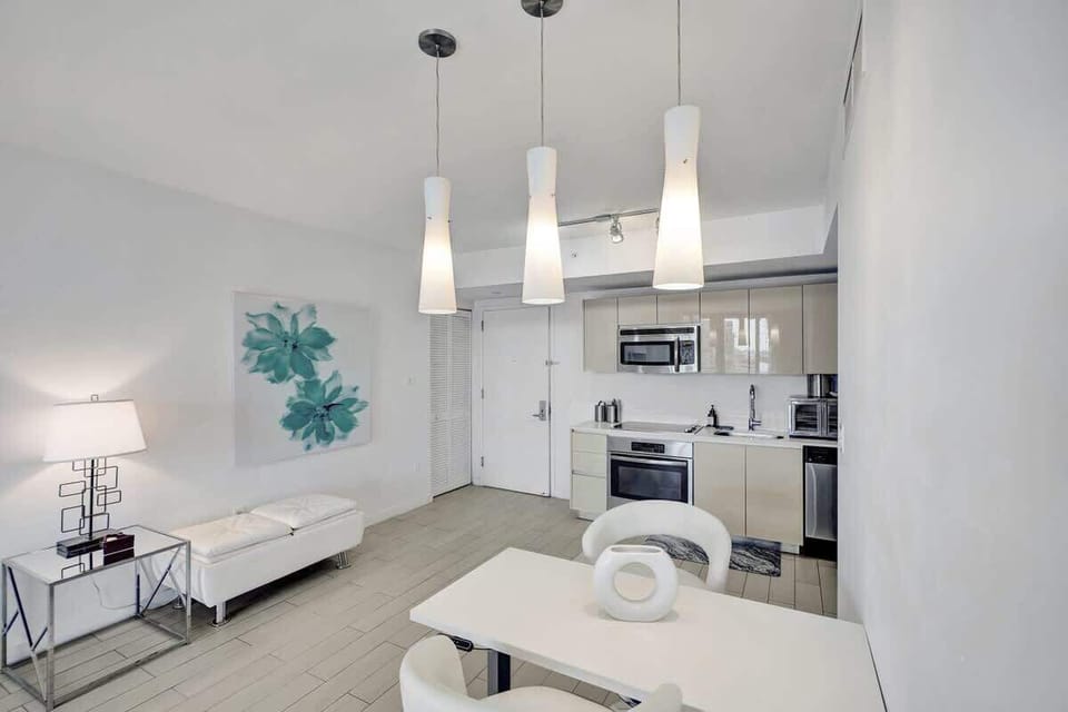 Open space living room combined with dining area and a kitchen