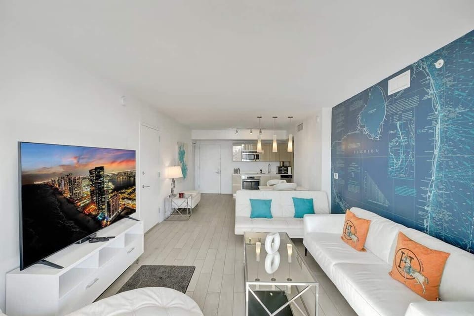 Open space living room combined with dining area and a kitchen