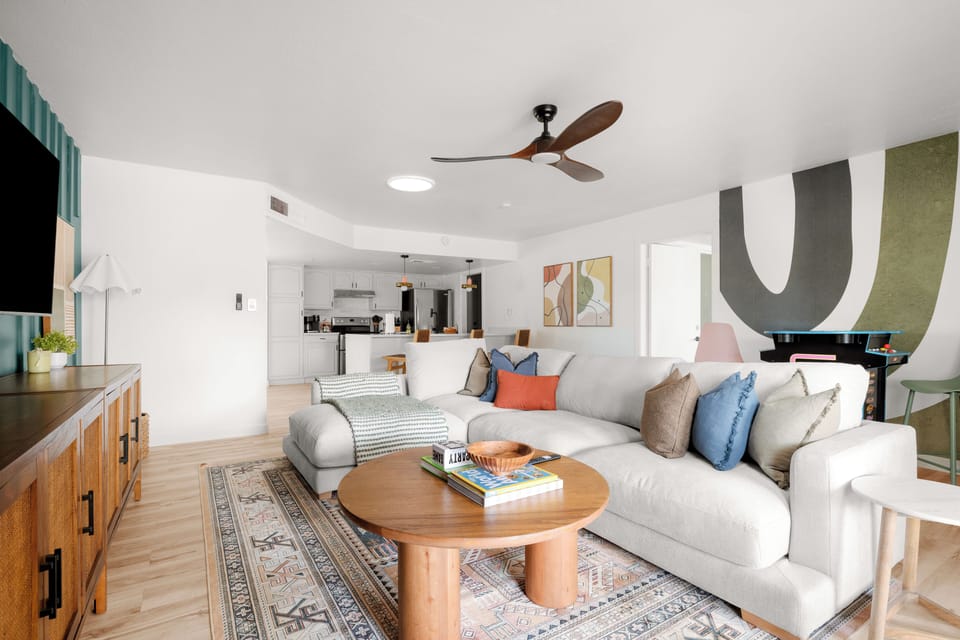 comfy sectional, open to the kitchen, with Mrs. Pacman, & arcade games 