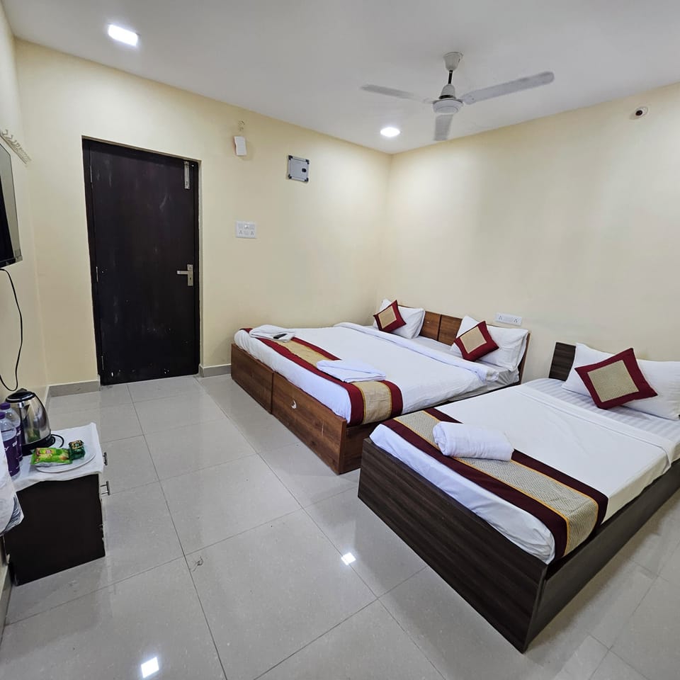 Deluxe Triple Room | Desk, blackout drapes, iron/ironing board, free WiFi