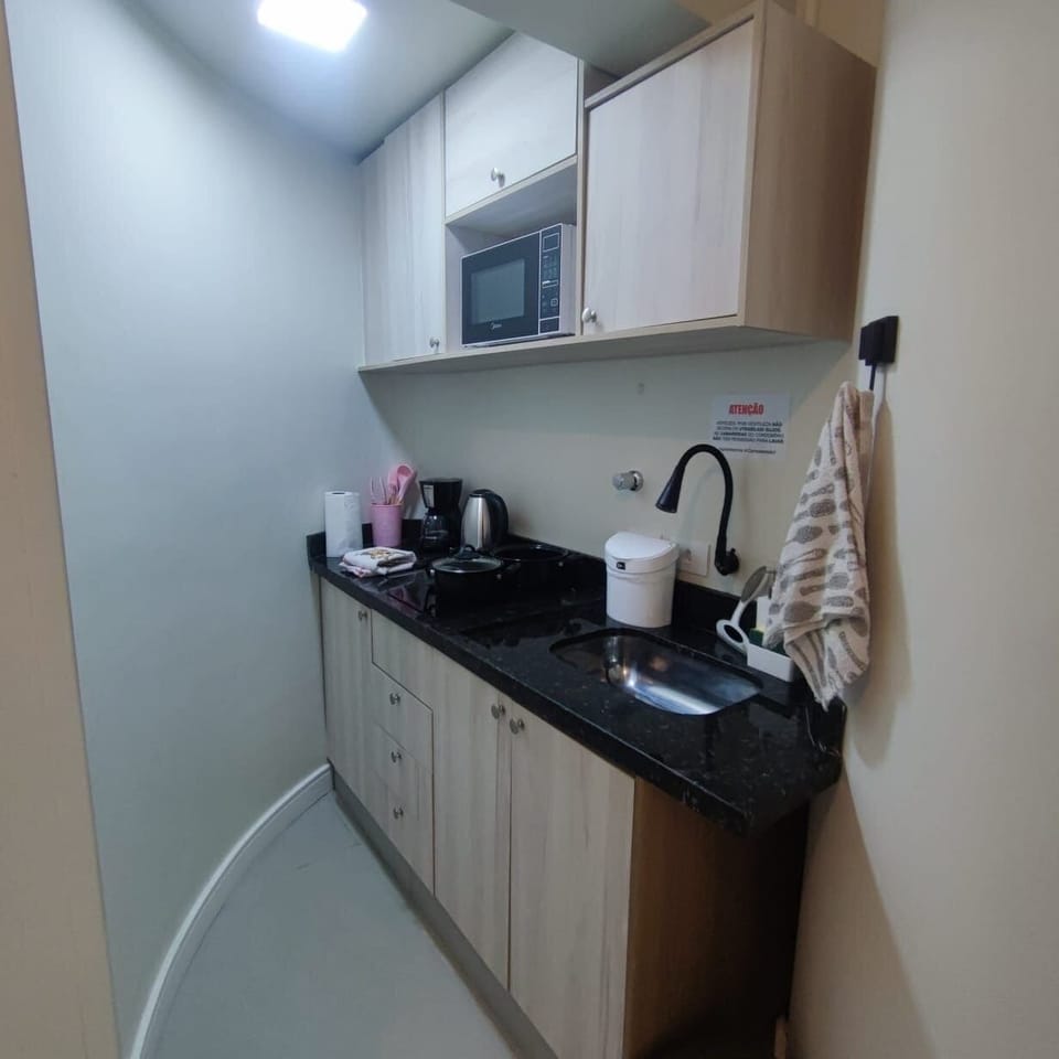 Apartment | Private kitchen | Mini-fridge, microwave, stovetop, cookware/dishes/utensils