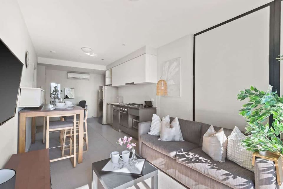 The kitchen & a living area with a 3-seater sofa bed that folds out to a double.