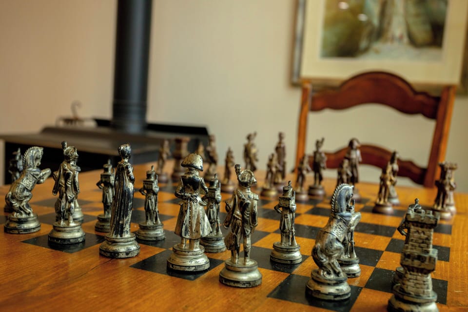  A closer look at the detailed chess pieces, adding character to the room.