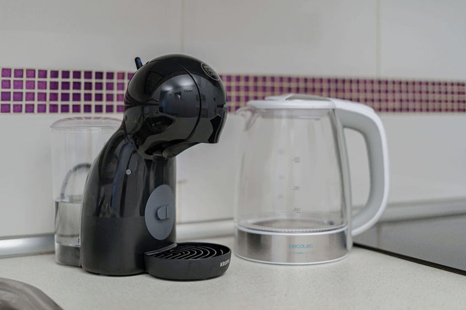 Kitchen with Coffee Maker, Toaster, Electric Kettle, Microwave, Oven, Stovetop, Dishwasher and Fridge