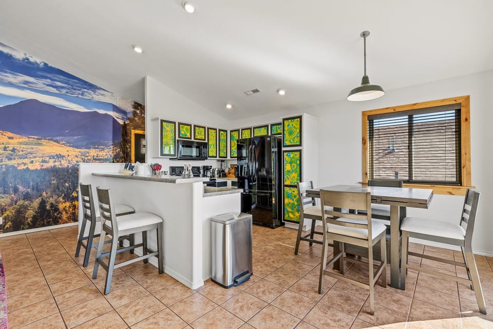 Dining area off of the kitchen. Table folds out to allow more seating.
