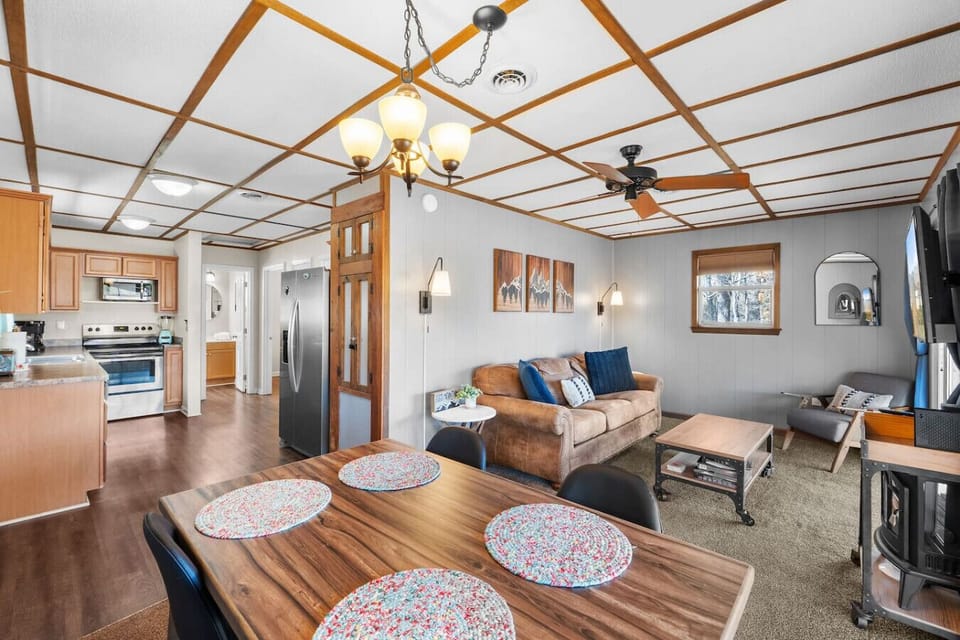 The dining table is conveniently located just off the kitchen and includes plenty of seating for 4.