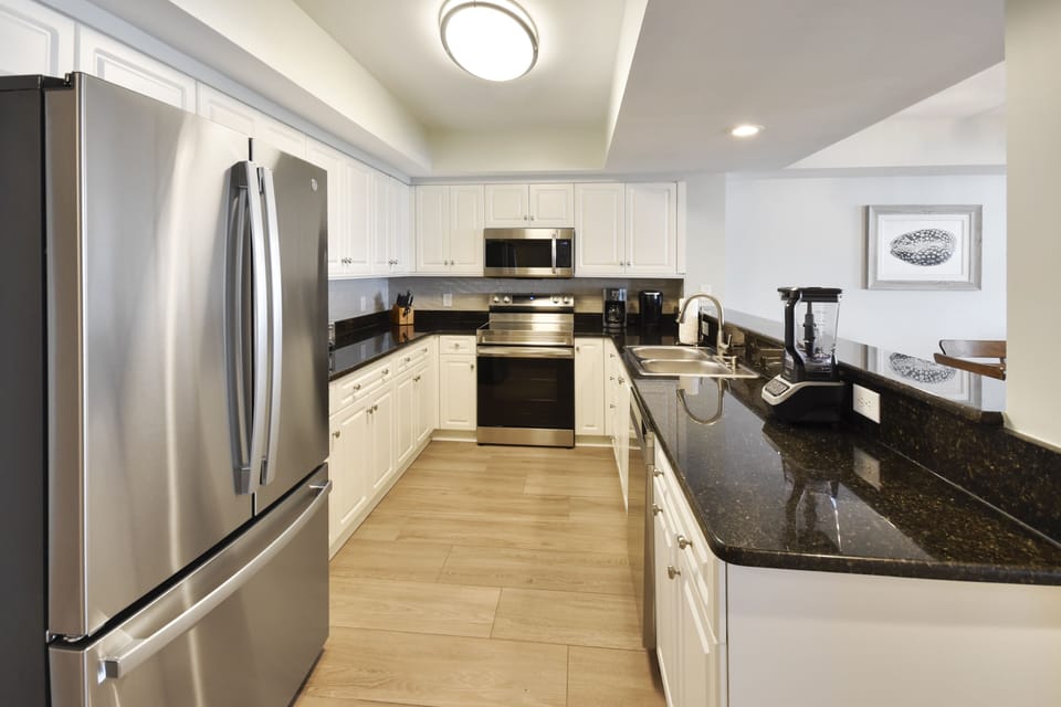 Condo, 5 Bedrooms | Private kitchen | Coffee/tea maker, fridge, oven, stovetop