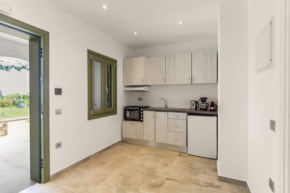 Kitchen Area – Fully Equipped with Storage
Modern layout with cabinetry, appliances, and counter space.