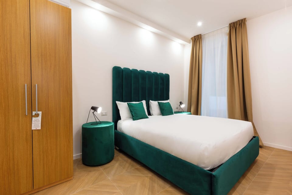 Deluxe Room, Patio, Garden View | Minibar, in-room safe, desk, laptop workspace