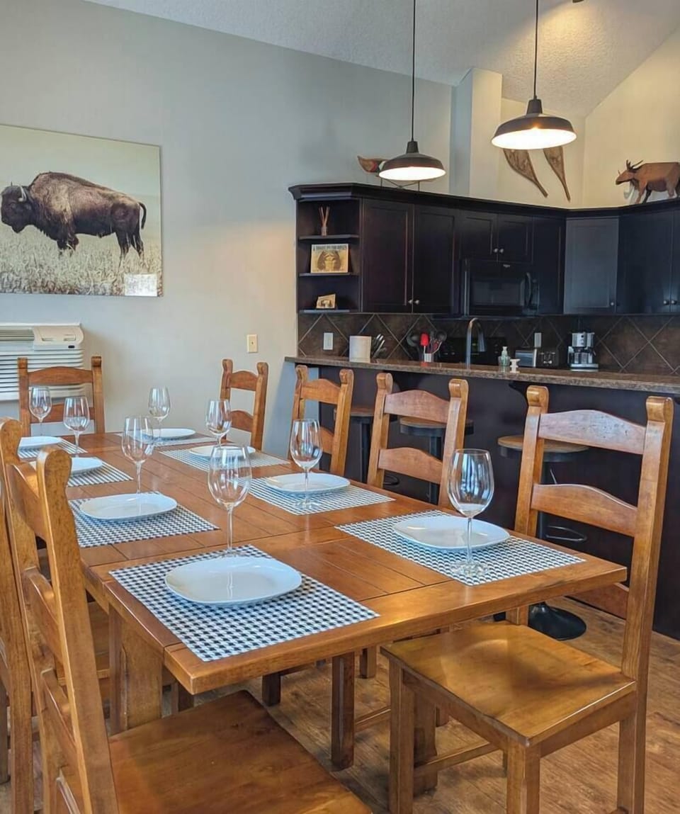 Fully equipped kitchen and a dining table for 10 and bar seating for 4