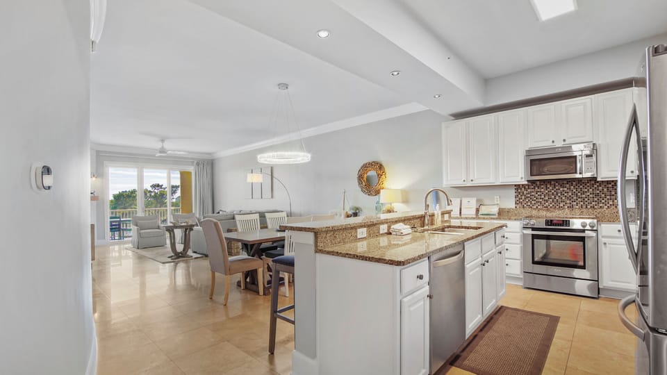 Open concept kitchen, dining and living room
