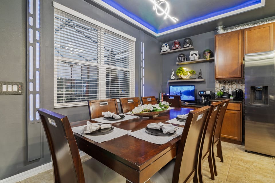 Dining table seats seven; an extra chair adds an eighth with ease.