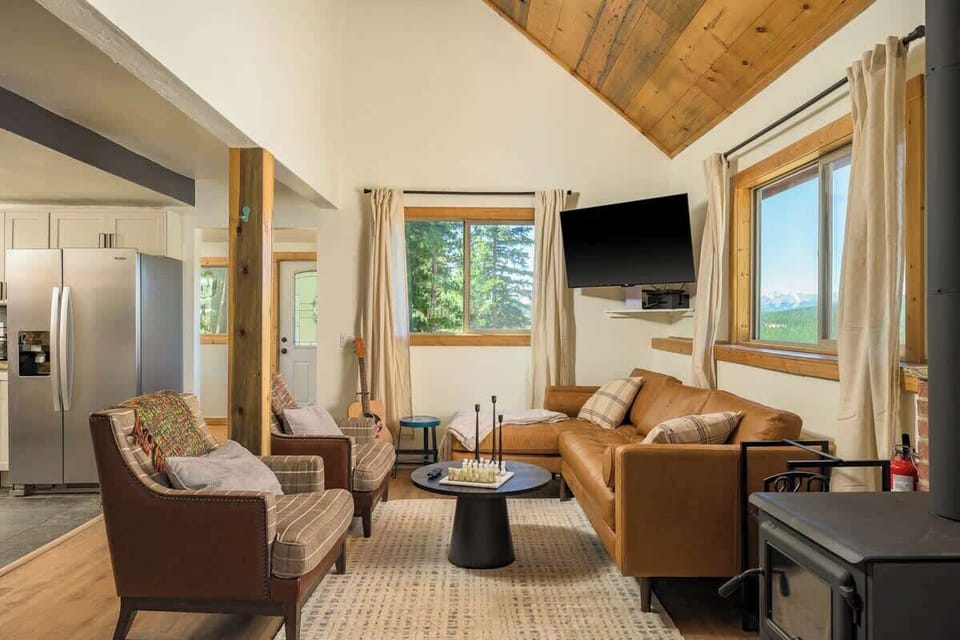 The living room has a new wood burning fireplace, with board games, at TV with internet connectivity and a vinyl turn table.