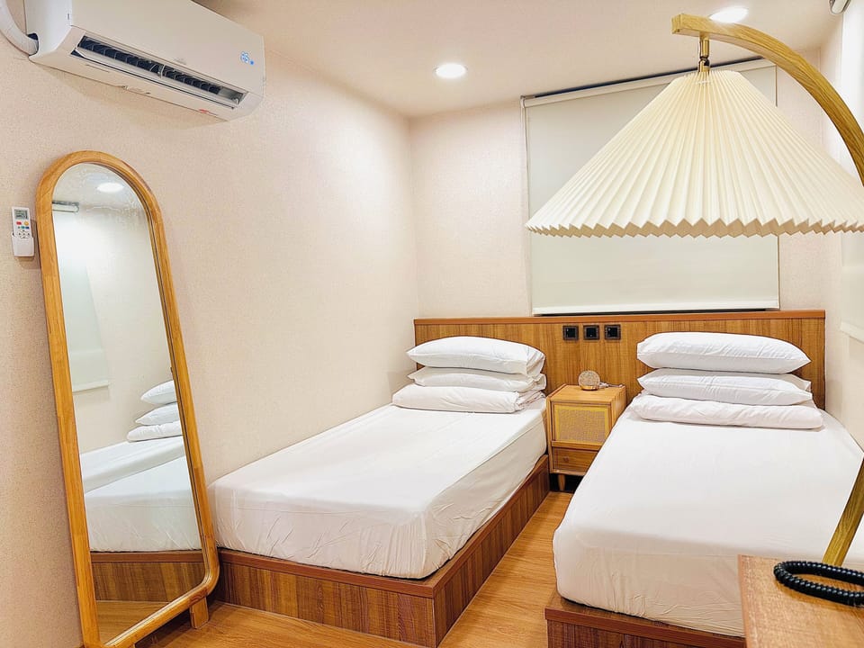 Premium bedding, desk, laptop workspace, soundproofing