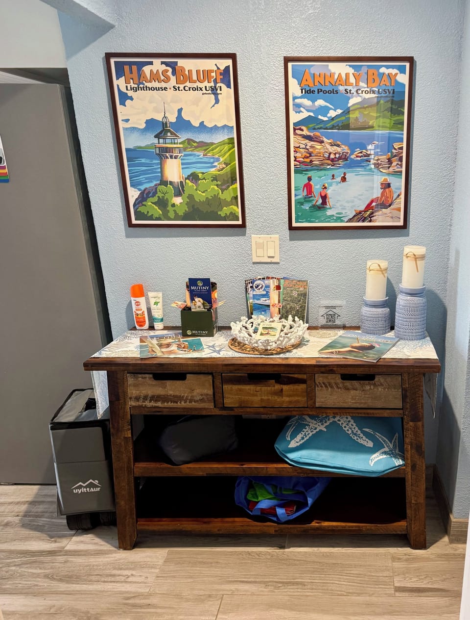 Entry area with beach cooler & grocery bags & bug spray plus a beach wagon.