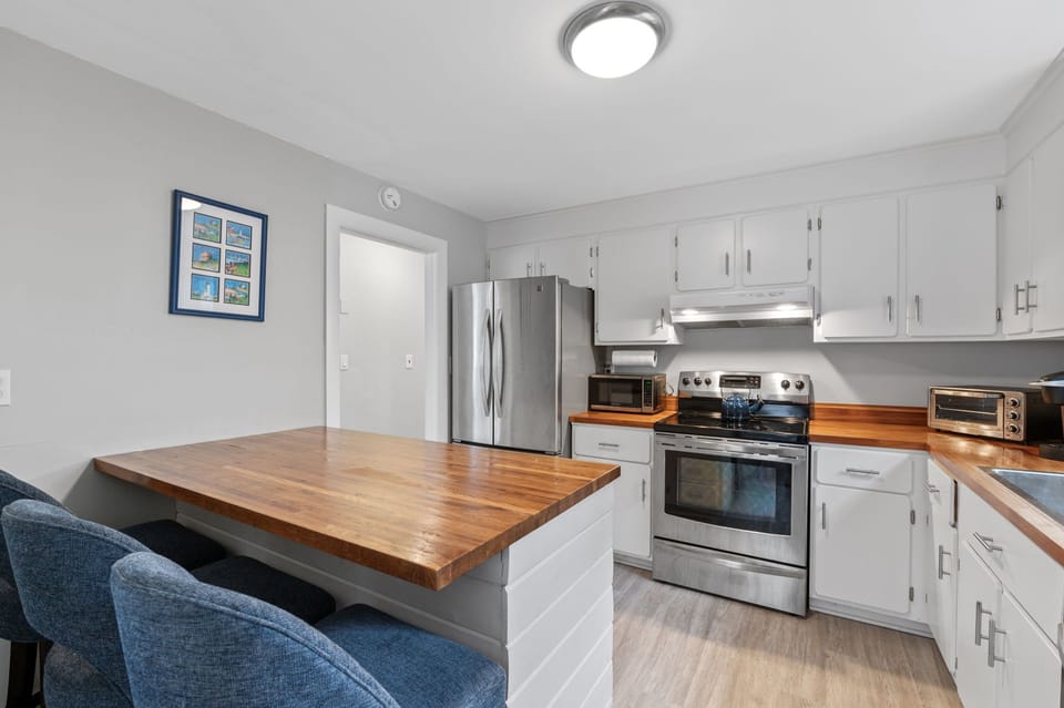Breakfast bar in the kitchen with three barstools