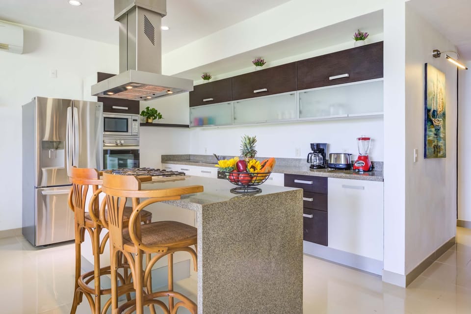 Fully equipped kitchen with full fridge, microwave, oven, stove, dishwasher and more
