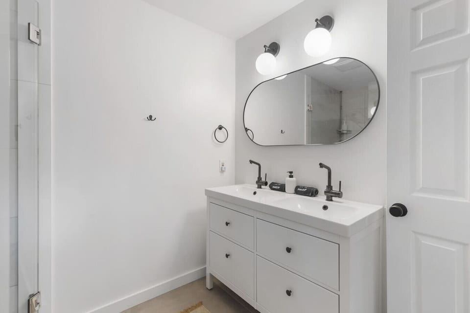 Full bathroom with shower, attached to bedroom #1. Located on the first floor of the house.