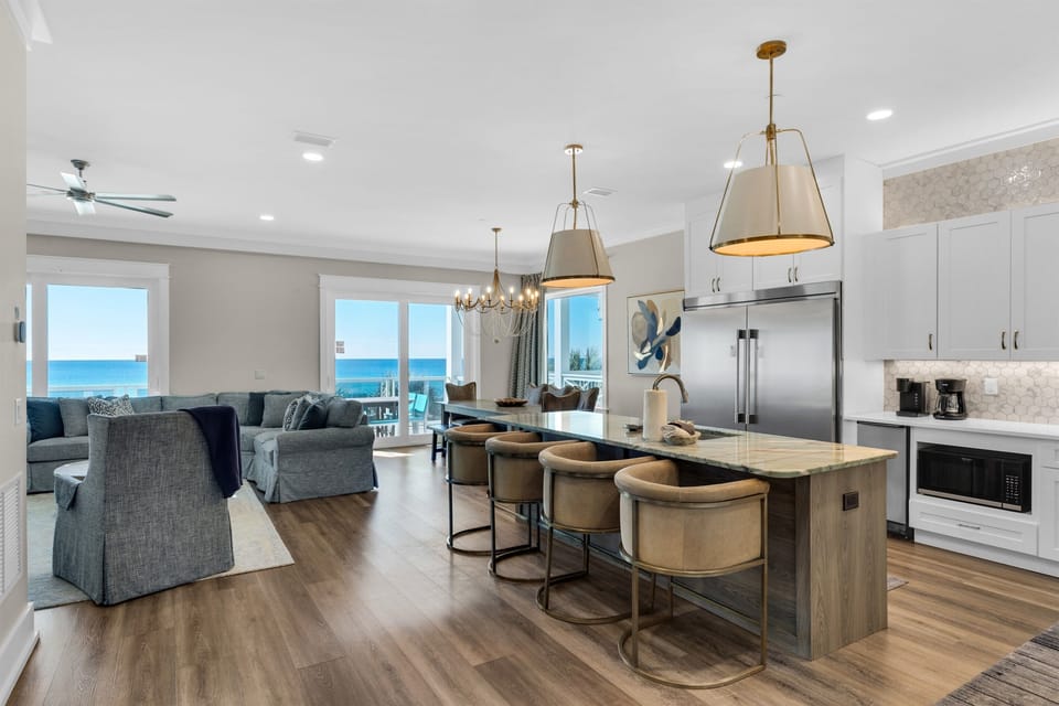 Stunning open-concept living with gourmet kitchen island and breathtaking ocean views from every window.