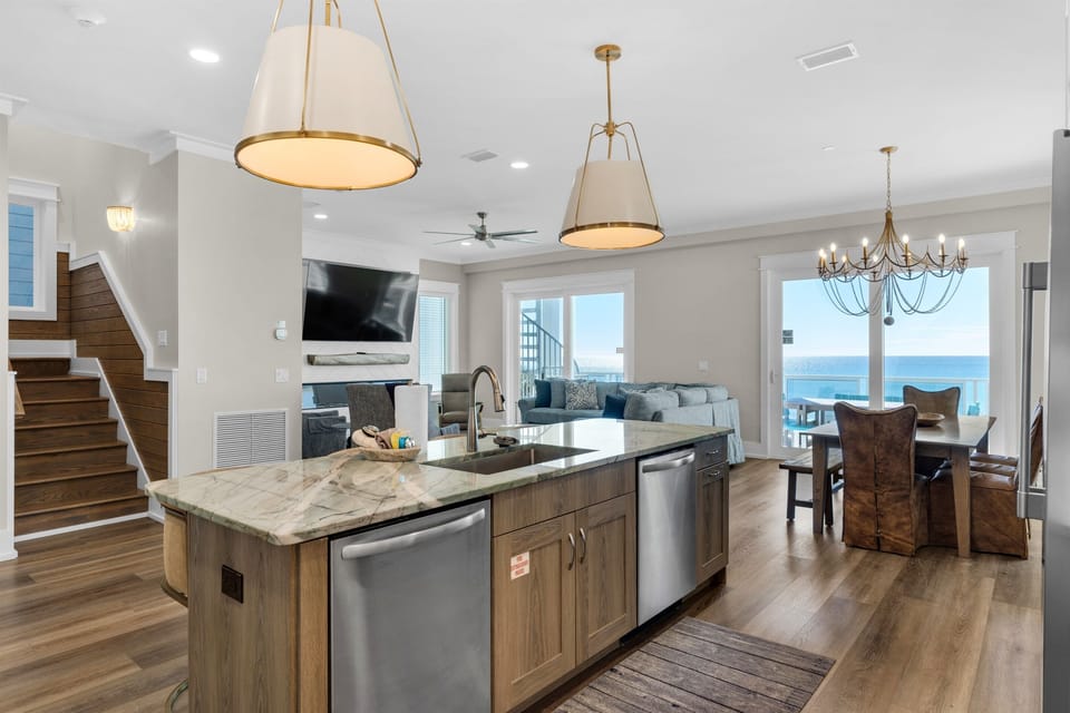Stunning sea views frame your perfect escape, where marble countertops and modern amenities create your ideal cooking space.