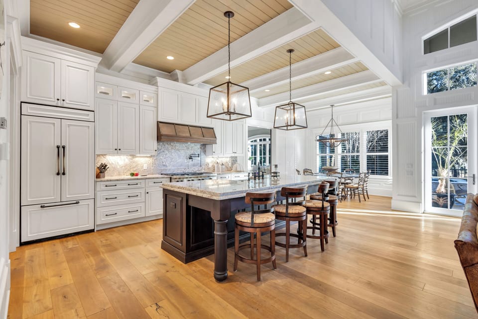 The chef's kitchen boasts high-end appliances, including a gas range and pot filler, perfect for cooking family meals or entertaining.