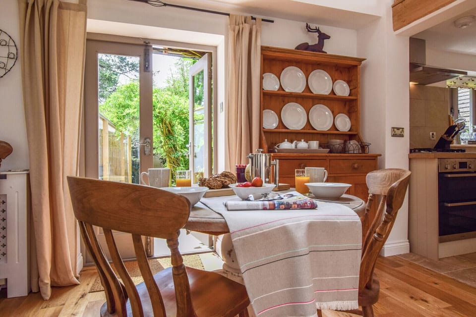 The dining area with antique dresser and views to the beautiful courtyard.