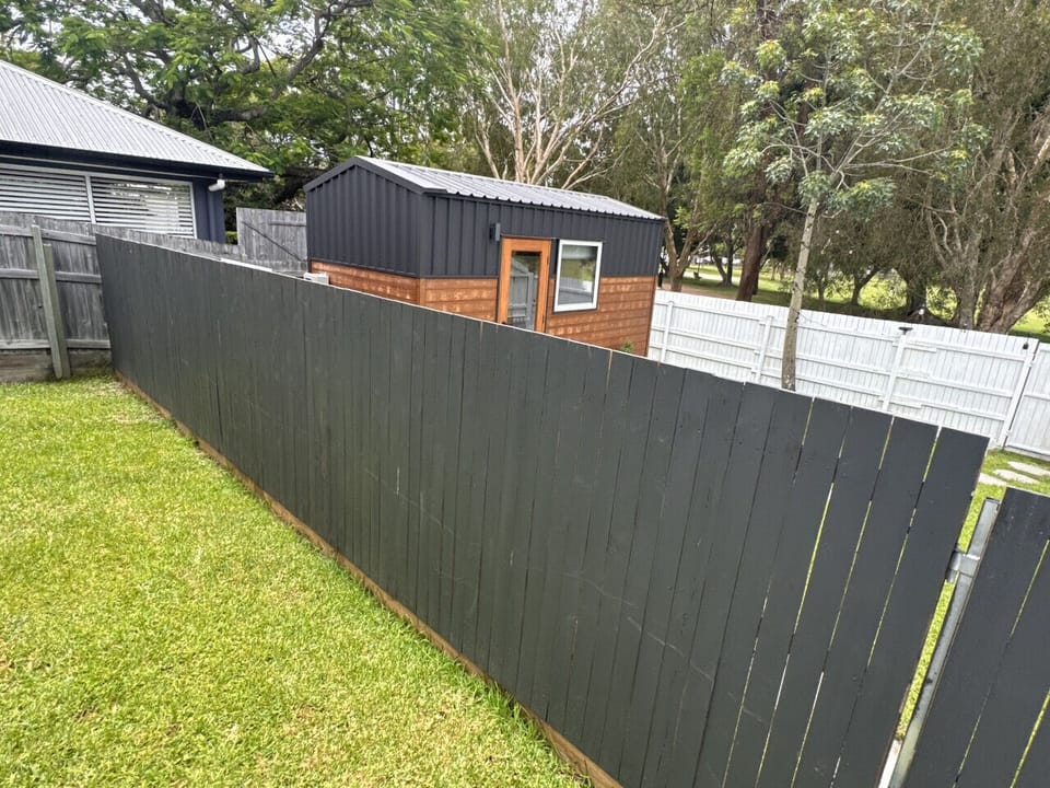Your back yard and tiny home privacy with surrounding fence.
