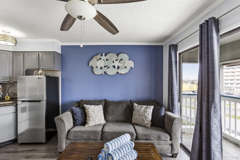 Modern living area with a cozy sofa and coastal décor.