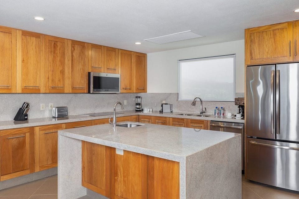 Luxury Suite, 2 Bedrooms, Oceanfront w/Deep Soaking Tub | Private kitchen | Mini-fridge, microwave, coffee/tea maker, cleaning supplies
