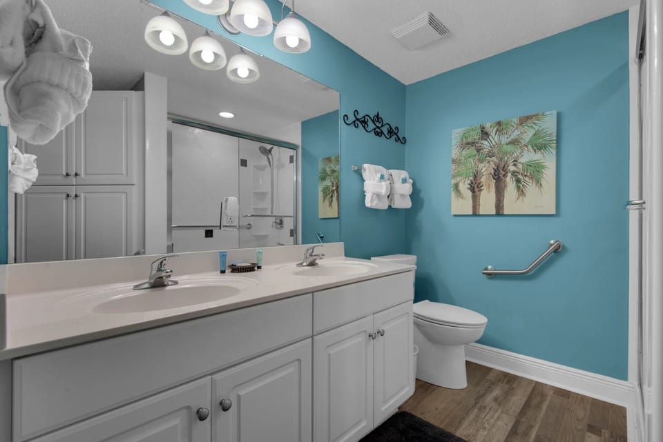 Master bath with double sink and walk-in shower