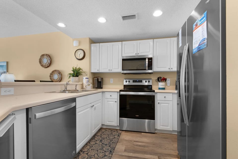 Fully stocked kitchen with updated stainless steel appliances