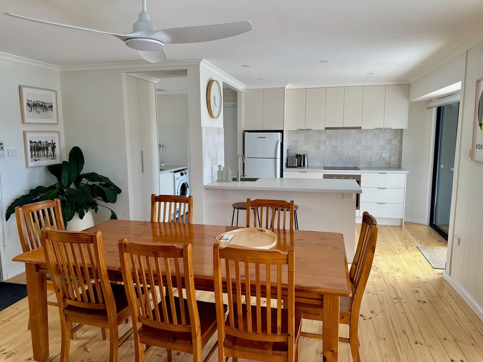 8-seat dining table with views out to the hills.
