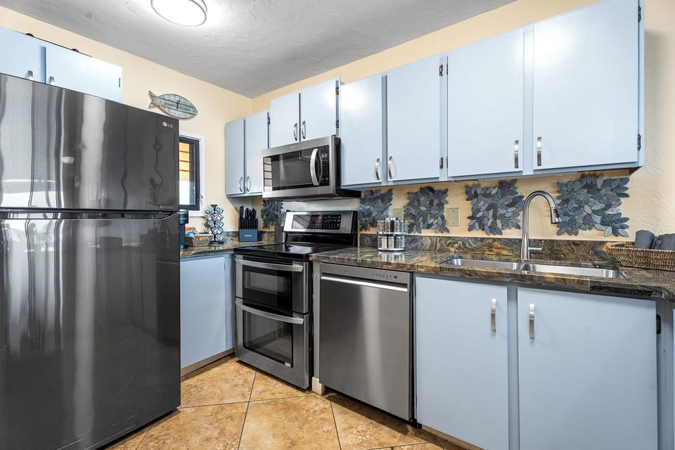 Full, well stocked kitchen with nice stainless appliances