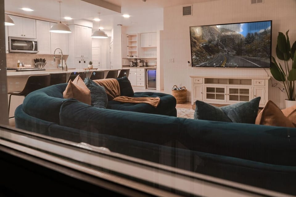 Beautifully designed living room with 75` in tv set!