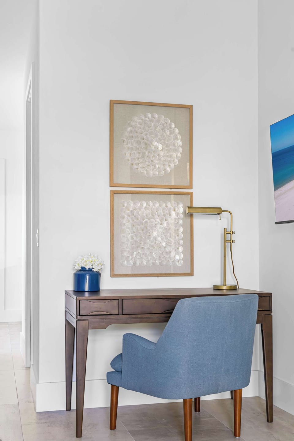 A quiet corner to catch up or unwind. This cozy desk nook is perfect for jotting postcards or planning tomorrow's beach day.