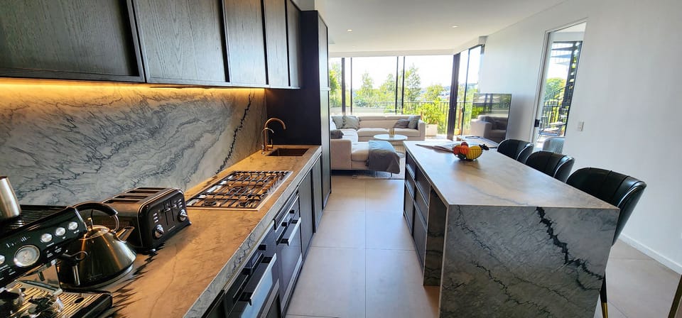 Barista style coffee machine, large marble kitchen island. Well equipped.