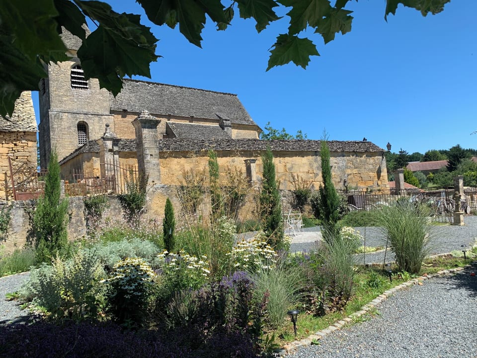 The garden, designed by a Hampton Court exhibitor, is overlooked by the church.