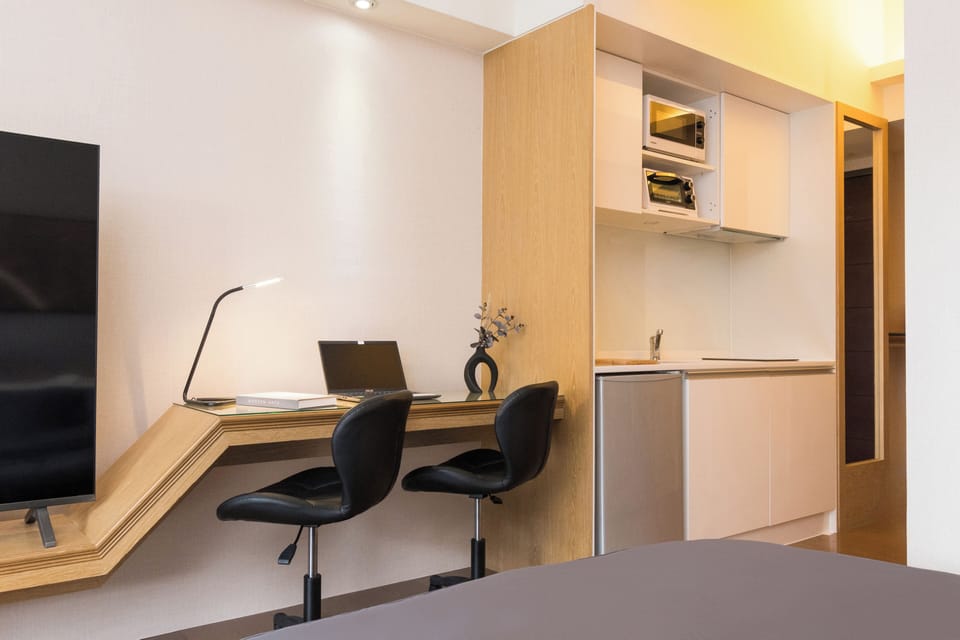 Bedroom Area:
• King Bed
• Closet
• 75" Smart TV
• Desk w/2 Office Chairs