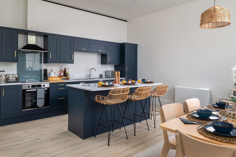 Indulge your inner chef in the elegant, fully equipped kitchen, complete with high-end appliances and everything you need to create and enjoy gourmet home-cooked meals.