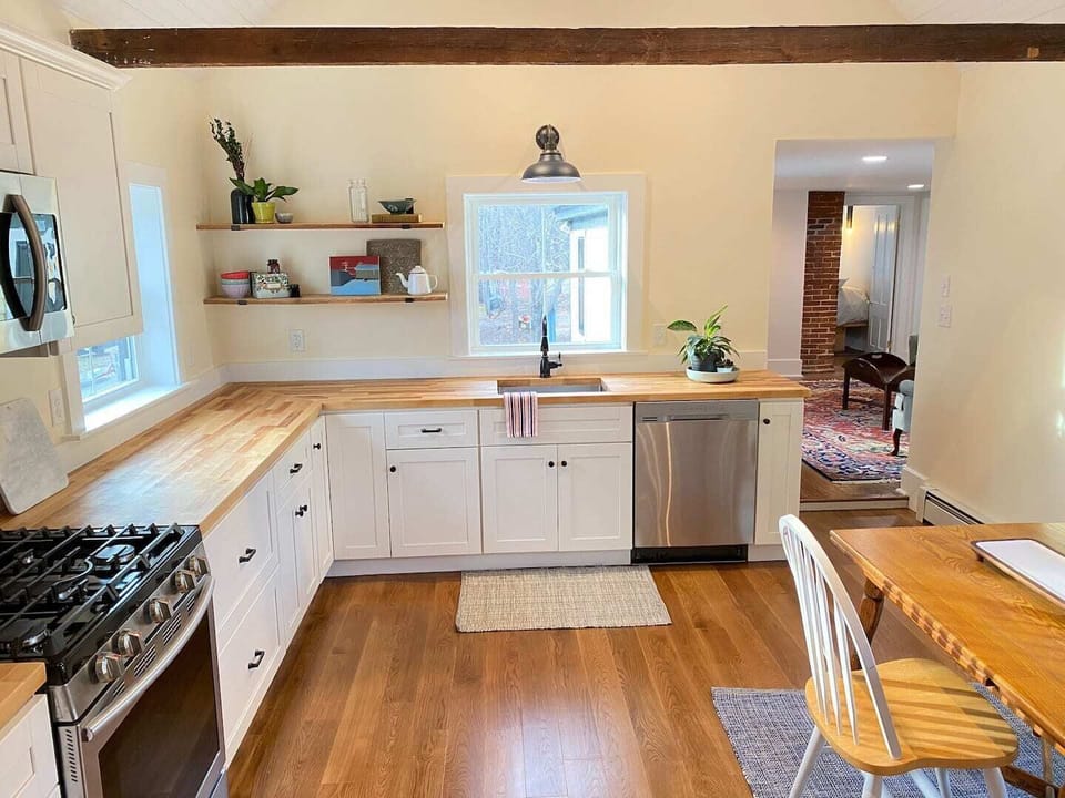Kitchen with cathedral ceiling, all new appliances, butcher block countertops, hardwood floors
