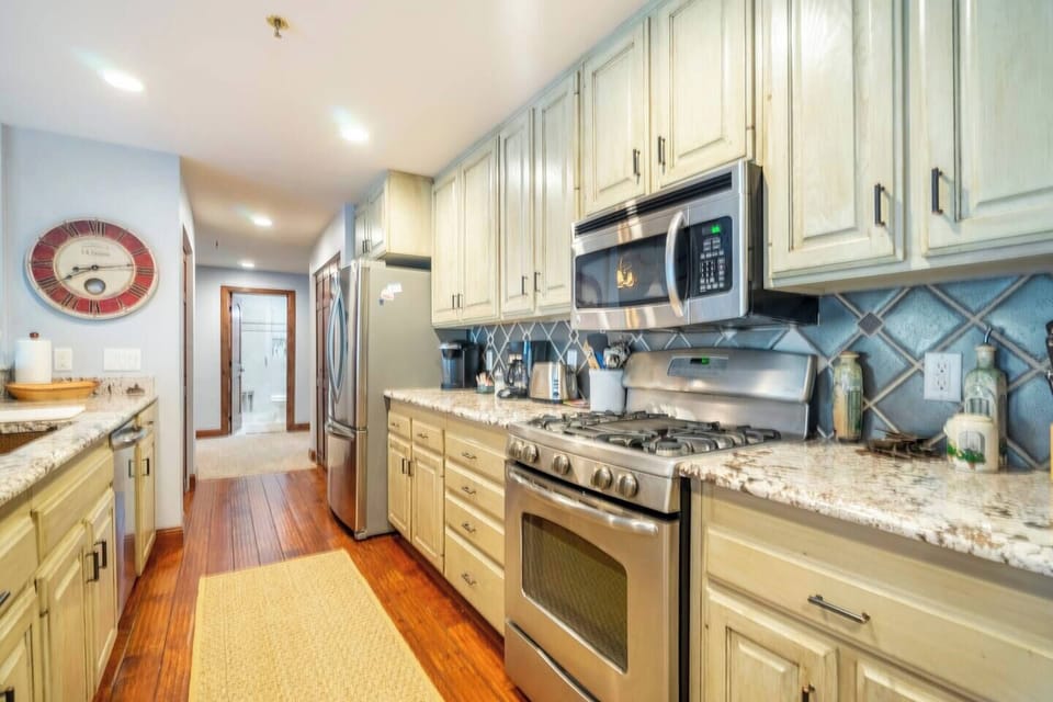 The large kitchen is fully equipped with gas stove, microwave, dishwasher and all of the cooking appliances and utensils you will need to eat in during your stay.