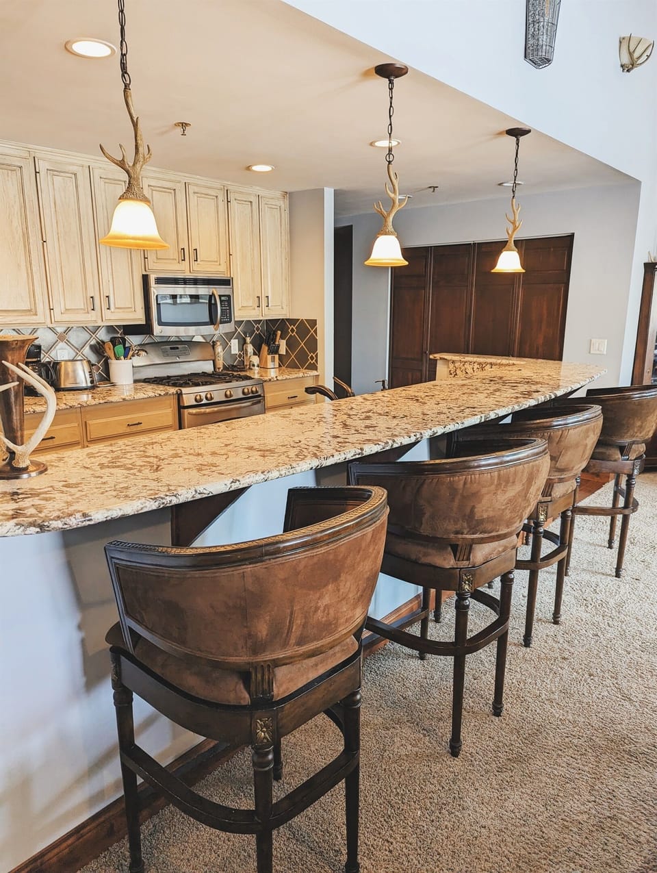 There is bar seating along the kitchen making total seating available for 10.