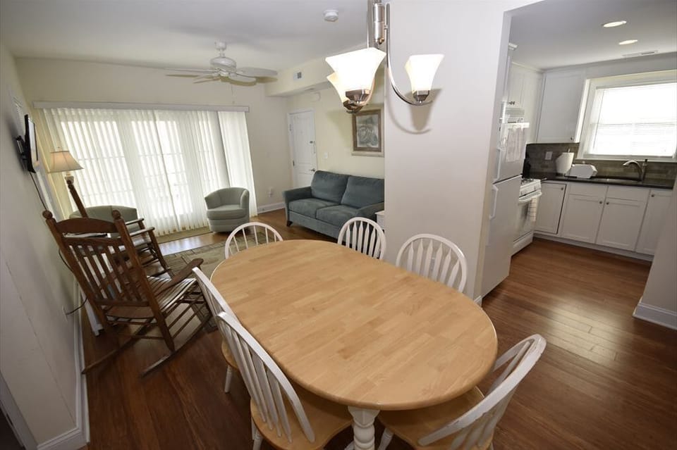 Bright and inviting dining area perfect for family meals, with easy access to the kitchen and plenty of seating.